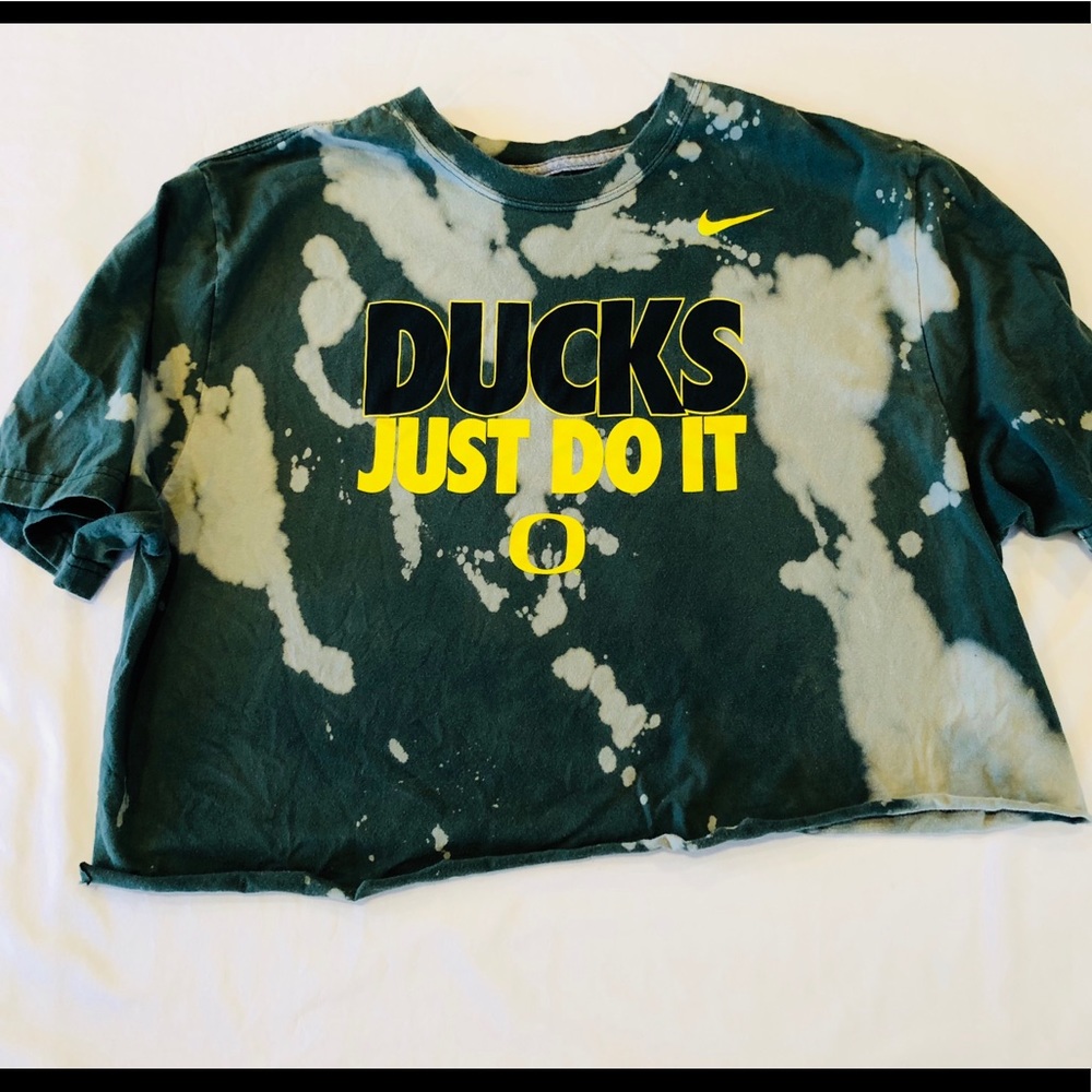 Green destroyed Nike Ducks crop top.